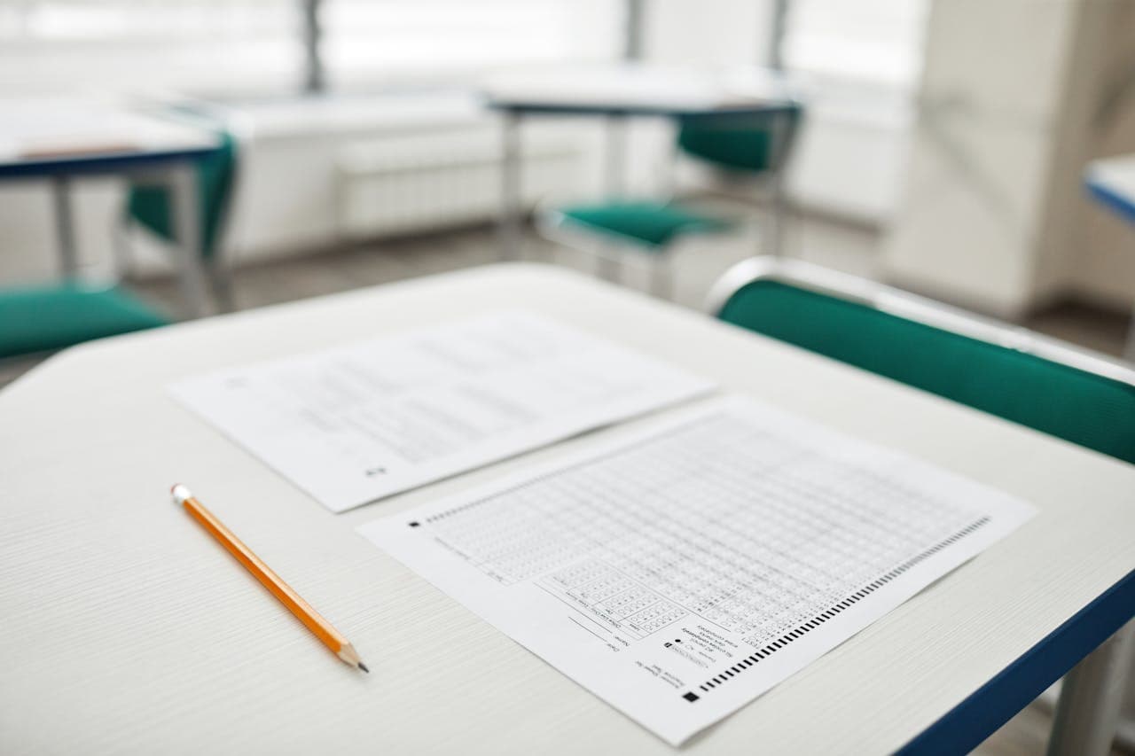 Person writing in an exam setting