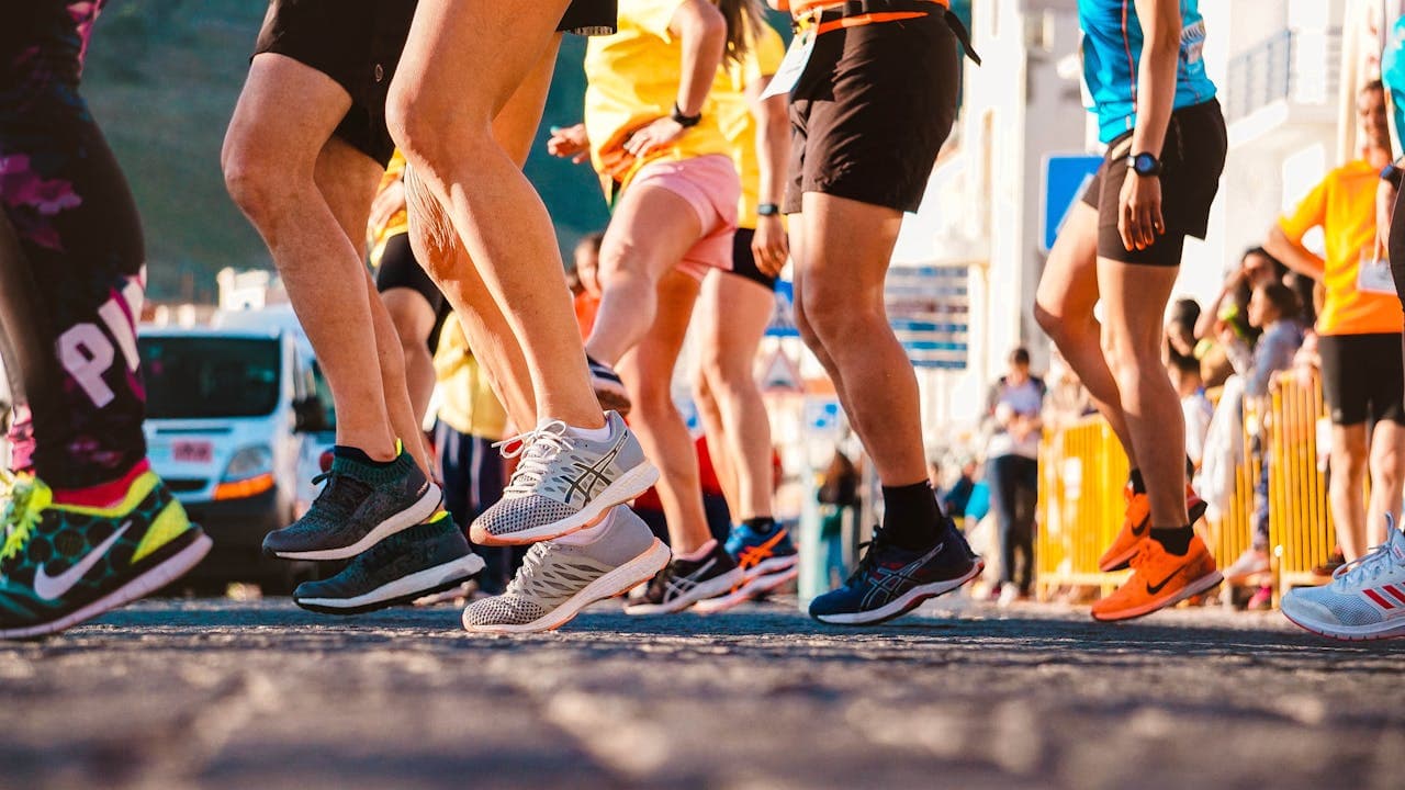 People wearing running shoes at a race